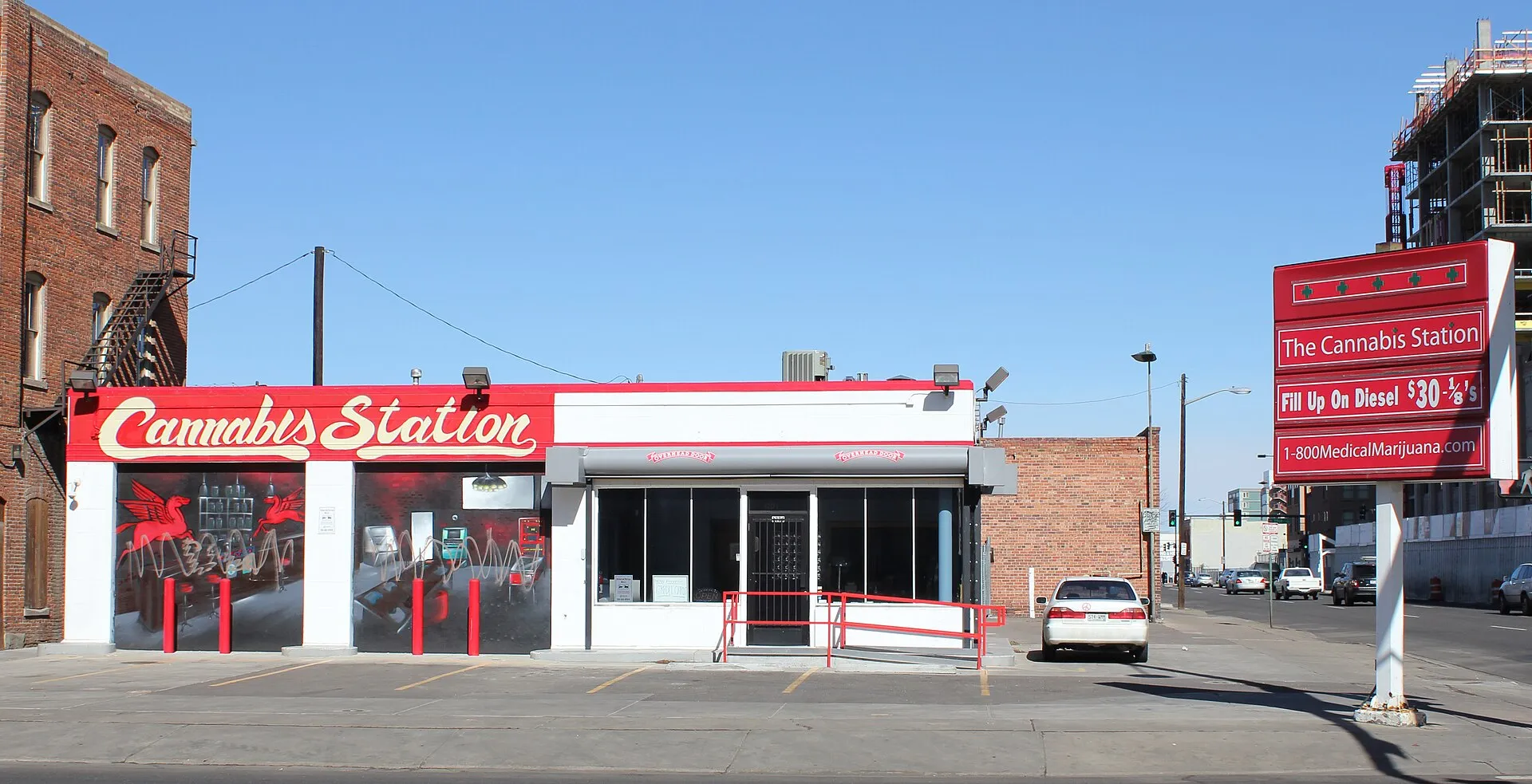 A converted red-and-white gas station in Denver operating as the Cannabis Station medical dispensary.