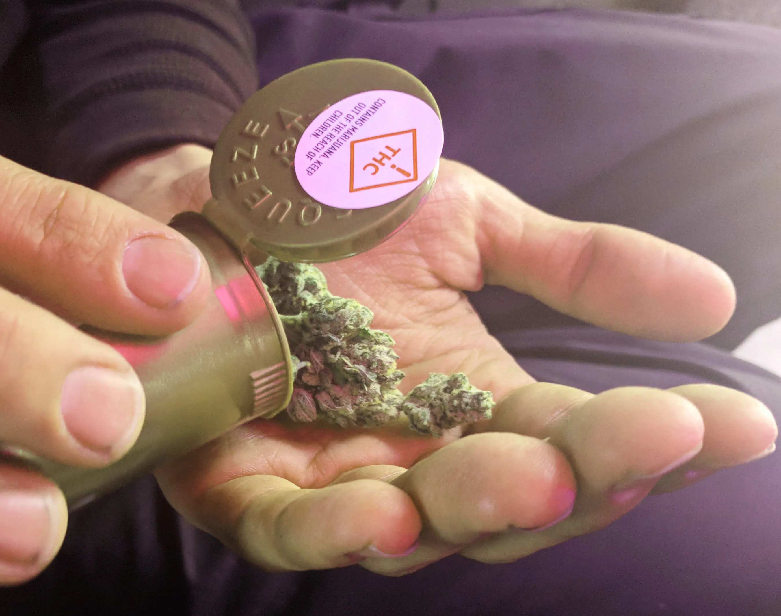 Packaged adult-use cannabis products for sale in a Denver, Colorado store.