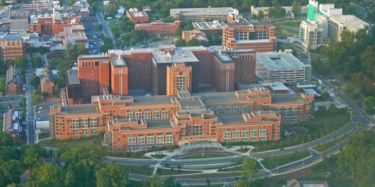 The National Institutes of Health campus in Bethesda, Maryland, seen from the air, with the Clinical Center at its center.